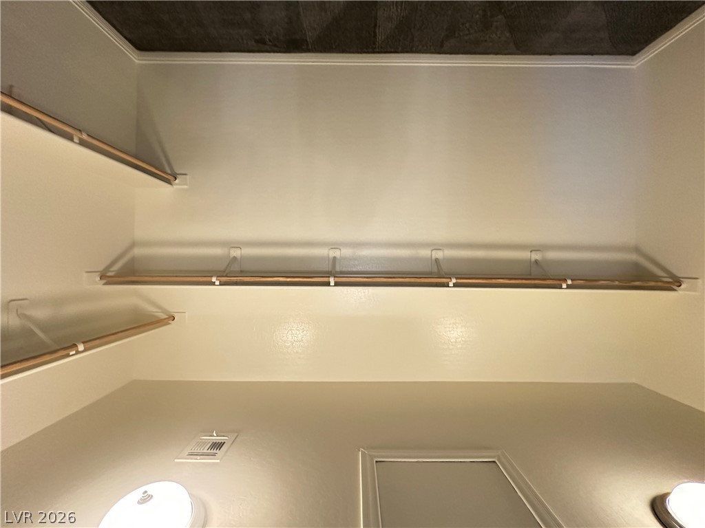 6784 Pivot Point Street Las Vegas, NV 89148 - Photo 15 of 27 Ample shelving and hanging space defines this well-organized closet.