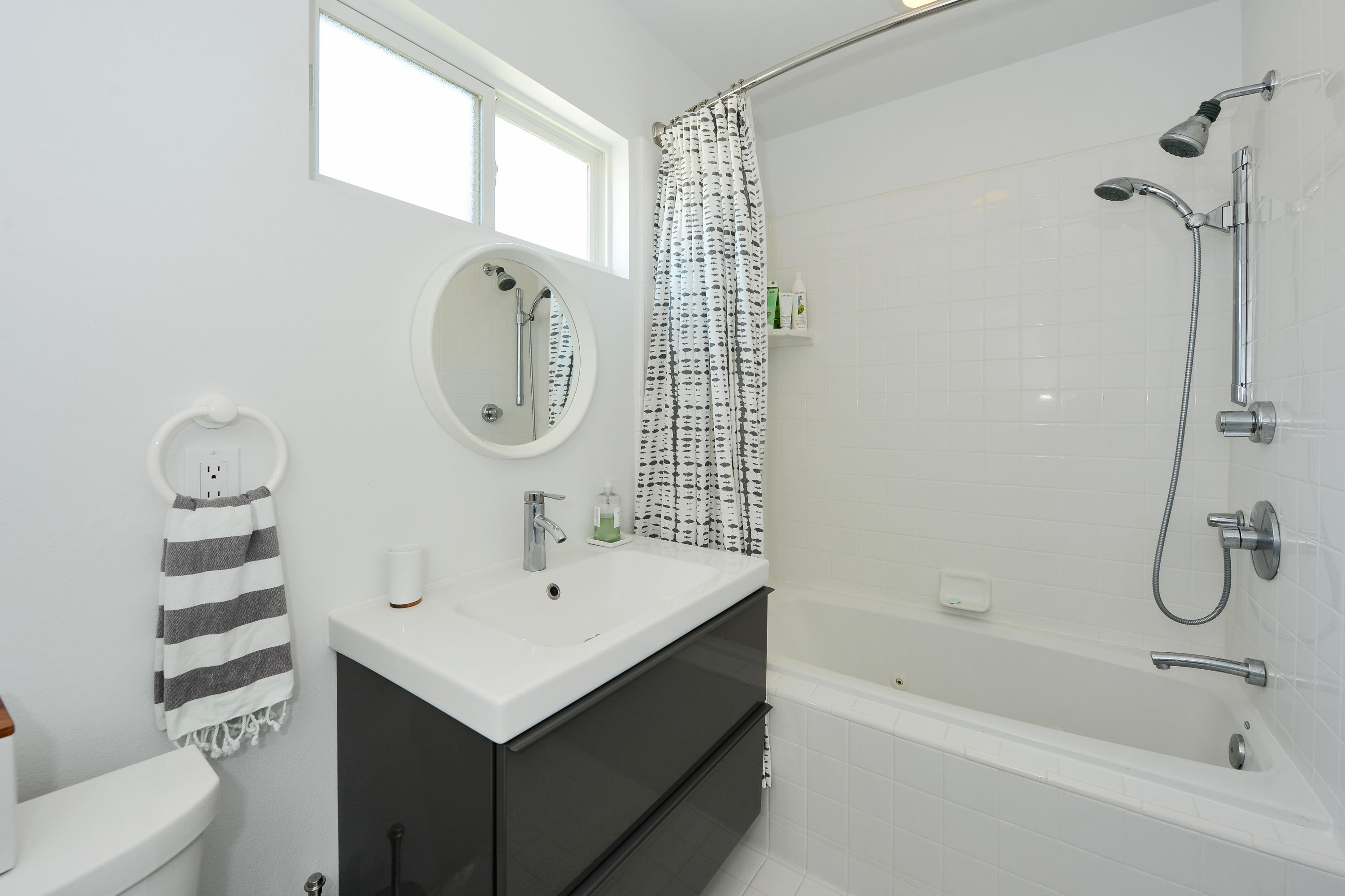 3600 Ocean Drive Oxnard, CA 93035 - Photo 14 of 30 a bathroom with a sink a toilet and shower