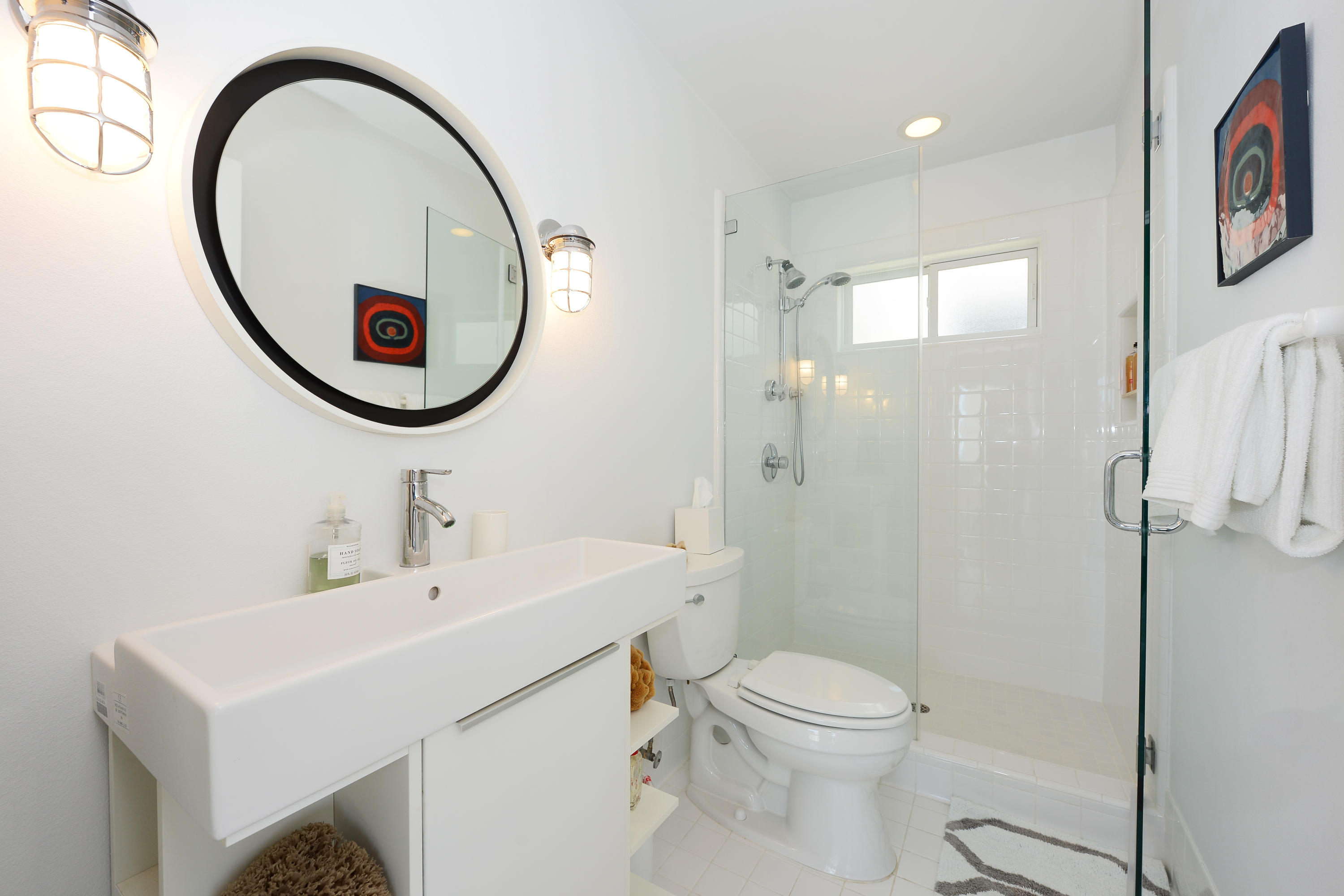 3600 Ocean Drive Oxnard, CA 93035 - Photo 19 of 30 a bathroom with a sink a toilet and a mirror