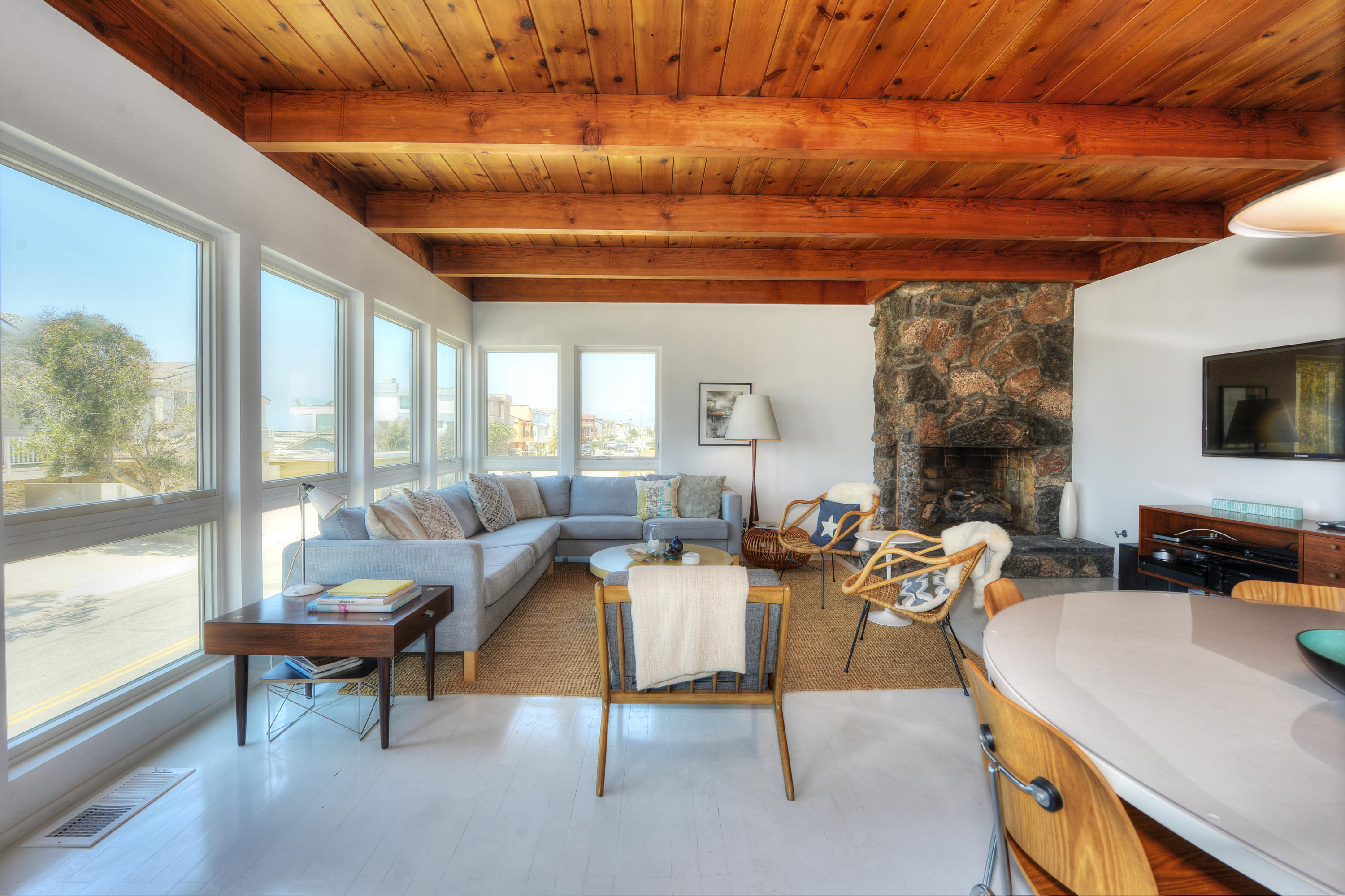 3600 Ocean Drive Oxnard, CA 93035 - Photo 27 of 30 a living room with furniture a flat screen tv and a large window