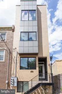 a view of a building with a door and windows