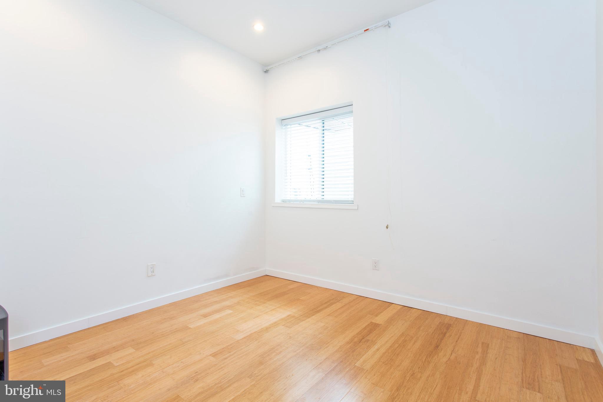 1519 Ogden Street, Unit 1 Philadelphia, PA 19130 - Photo 16 of 19 a view of empty room with wooden floor