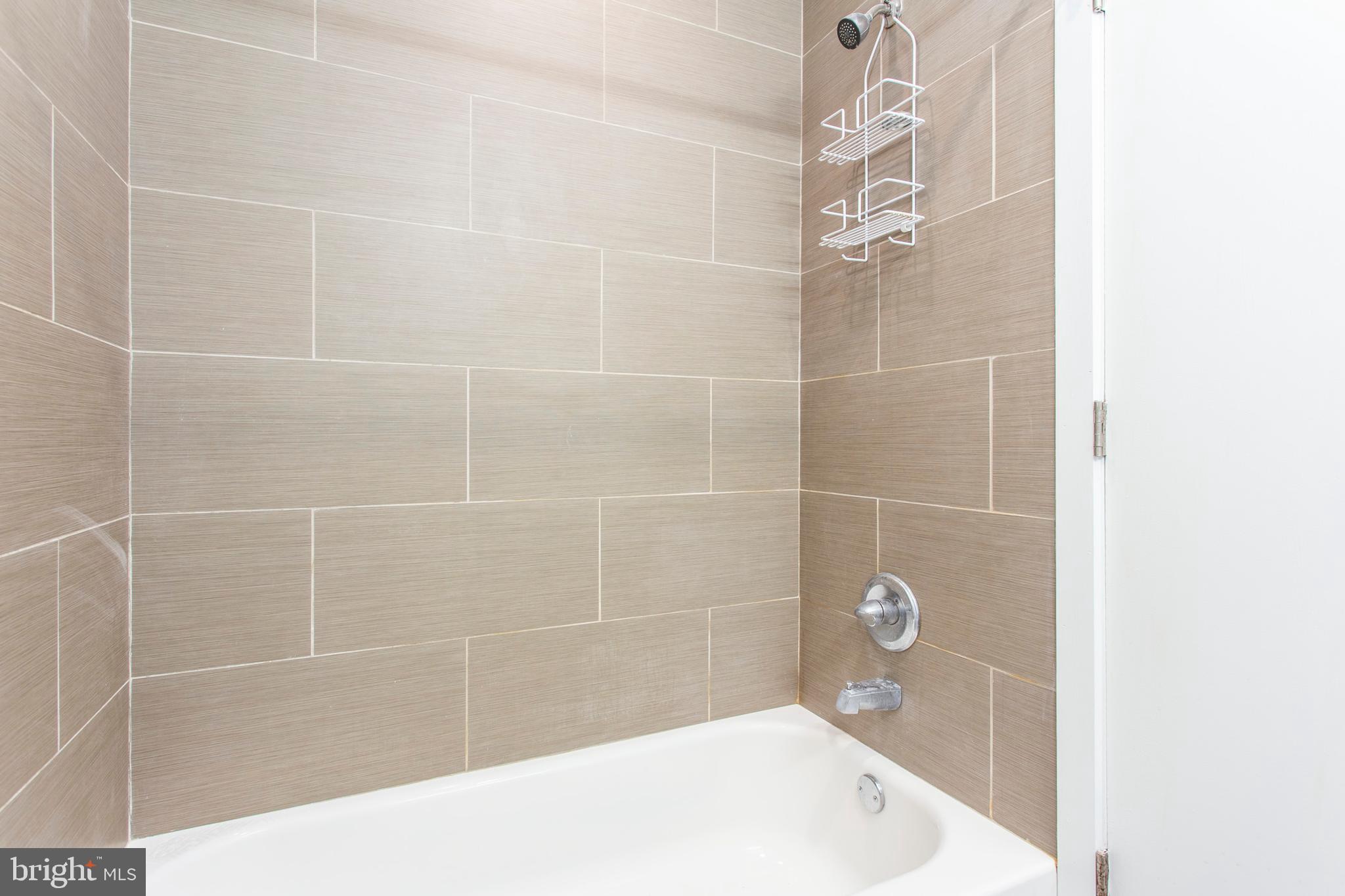 1519 Ogden Street, Unit 1 Philadelphia, PA 19130 - Photo 18 of 19 a bathroom with a bathtub