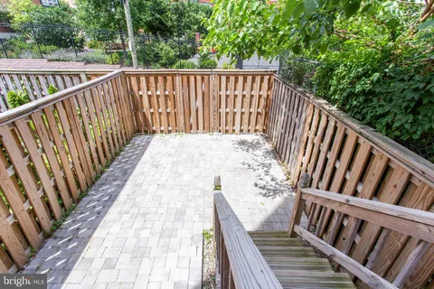 a view of wooden balcony with wooden floor