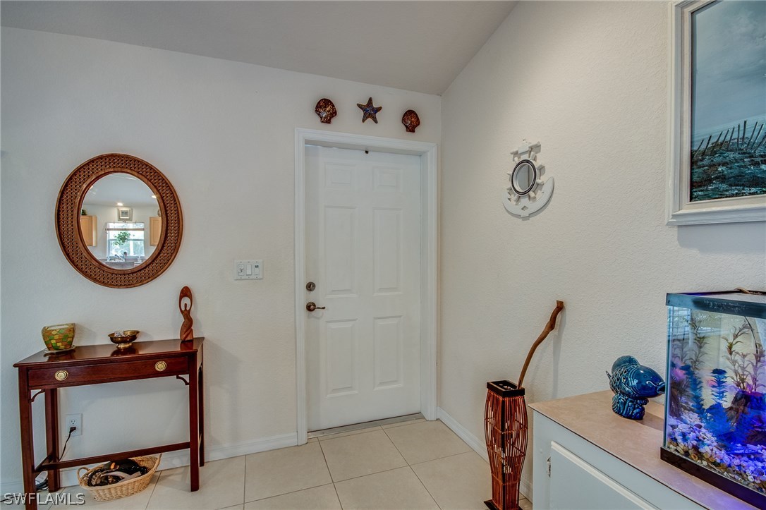 30073 Alder Road Punta Gorda, FL 33982 - Photo 3 of 25 a view of a room with a table and a chair