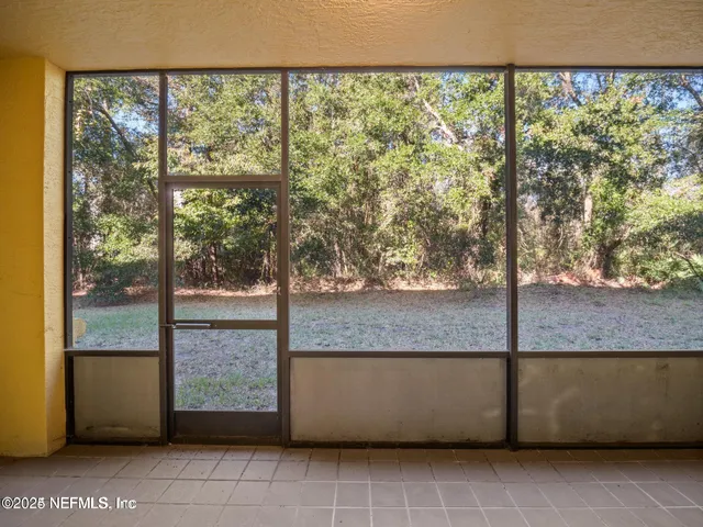 a view of an empty room and window