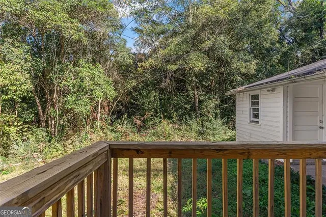 a view of a balcony with wooden floor