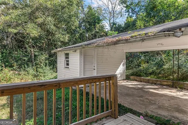 a balcony view with a backyard space