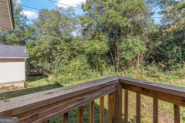 a view of balcony with wooden floor