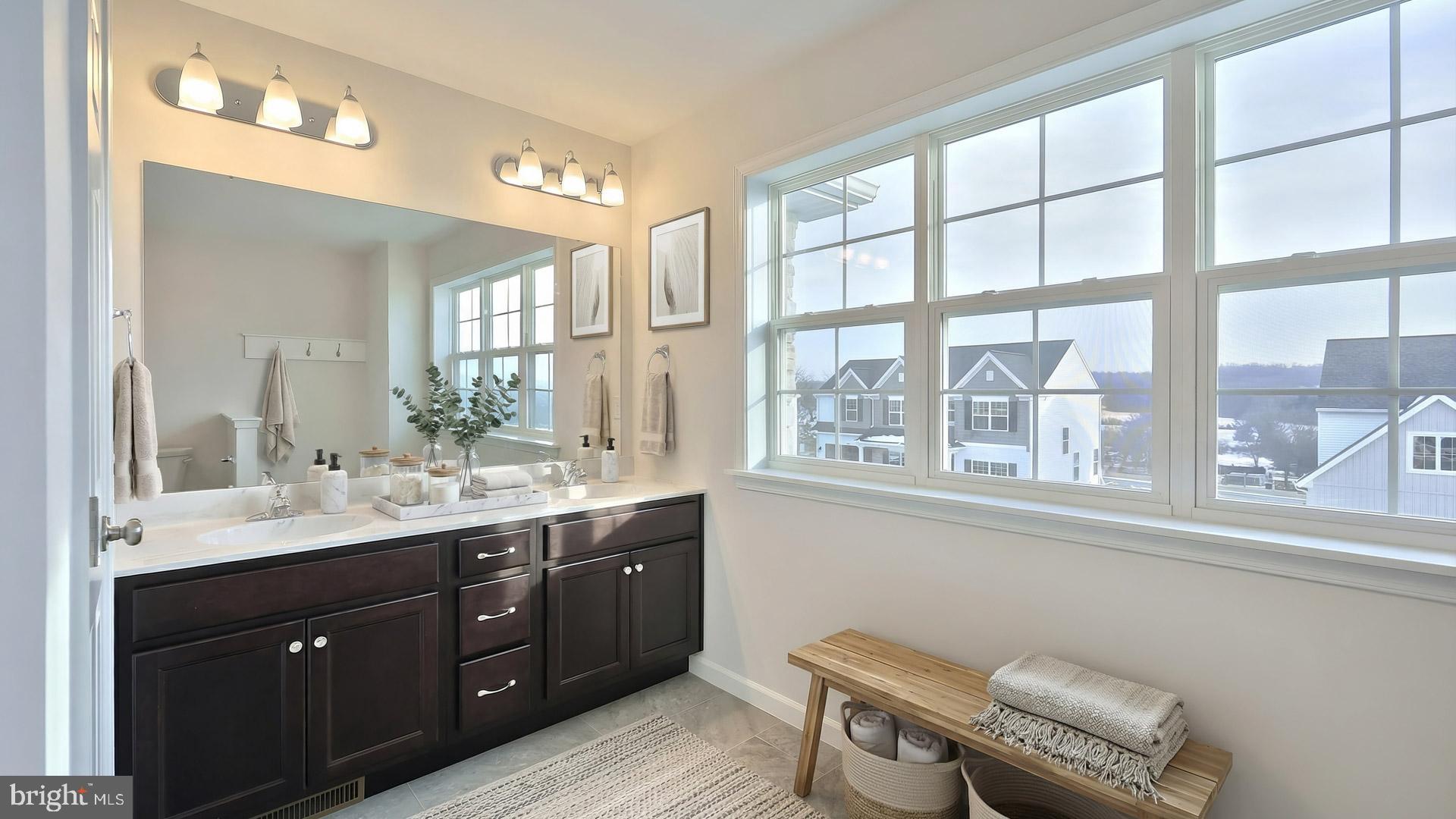 220 Copper Ridge Drive Newmanstown, PA 17073 - Photo 12 of 31 a spacious bathroom with a double vanity sink a large mirror and a toilet
