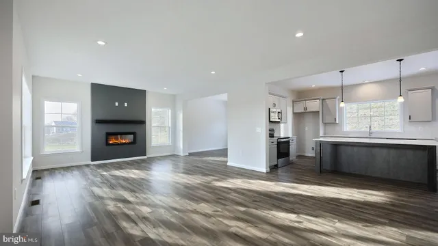 a view of a kitchen with a sink and a fireplace