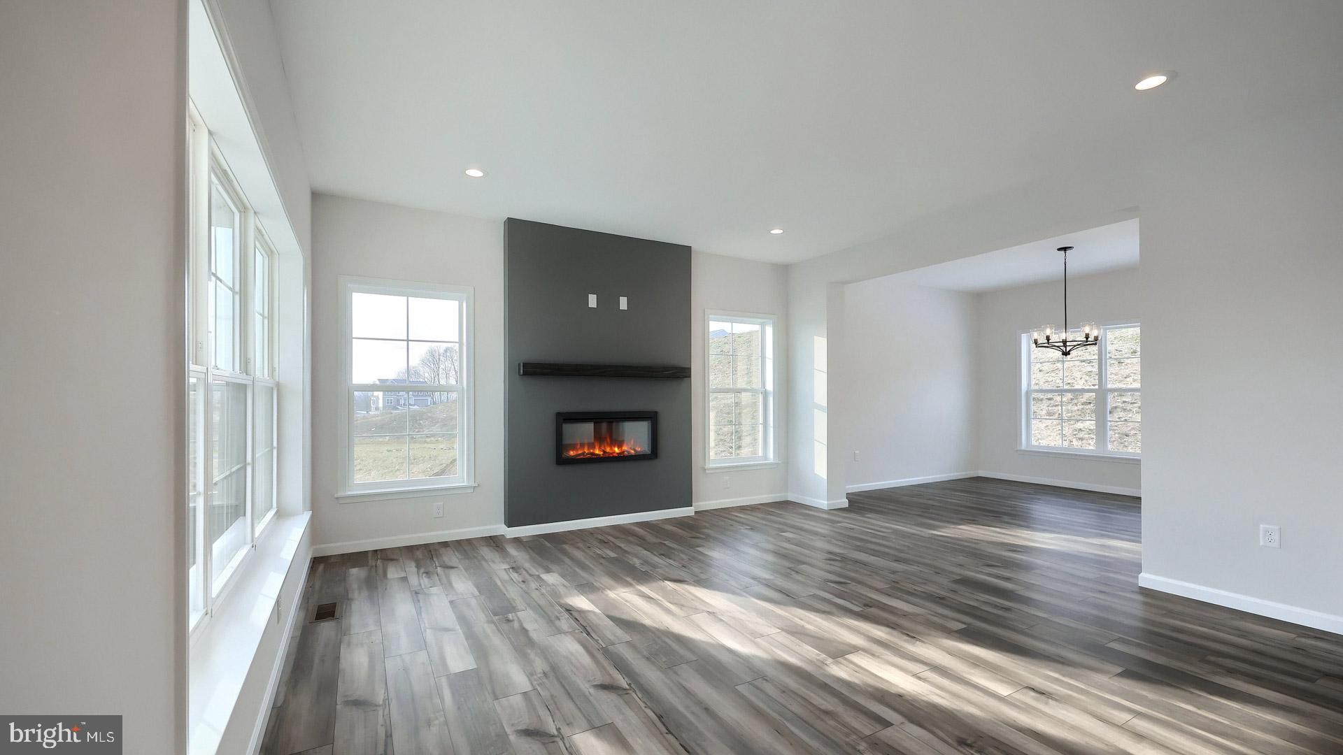 220 Copper Ridge Drive Newmanstown, PA 17073 - Photo 16 of 31 a view of an empty room with wooden floor and a window