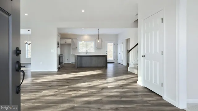 a view of a kitchen with a sink and cabinets