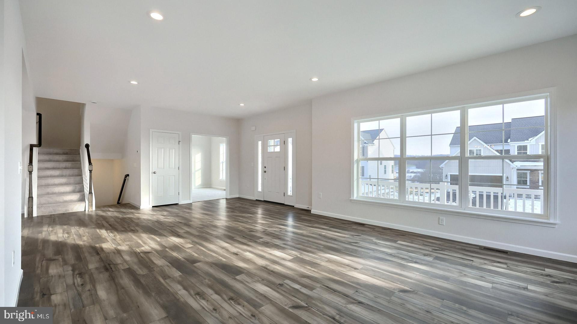 220 Copper Ridge Drive Newmanstown, PA 17073 - Photo 29 of 31 a view of an empty room with a window and wooden floor