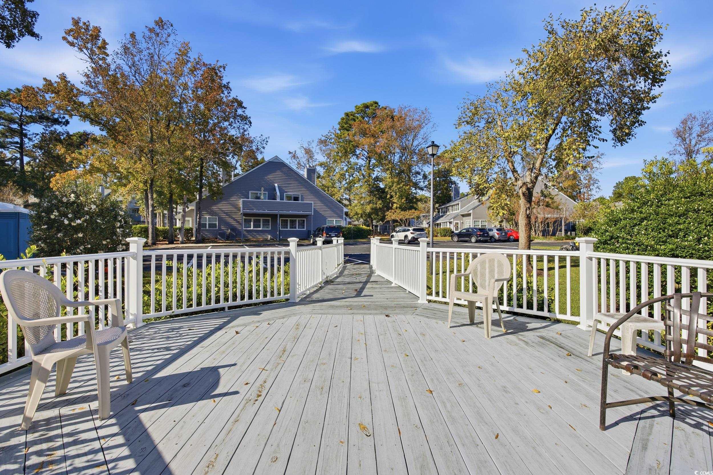 1200 Benna Drive, Unit 1C Myrtle Beach, SC 29577 - Photo 29 of 37 Deck with a residential view