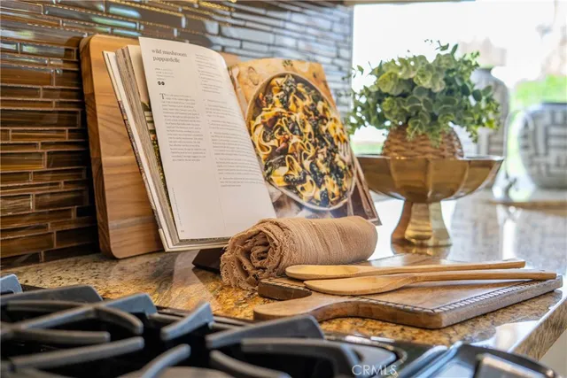 a view of a patio with table and chairs and potted plants