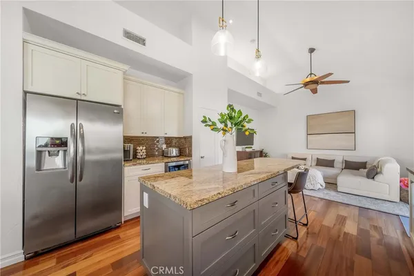 a view of a kitchen with granite countertop cabinets