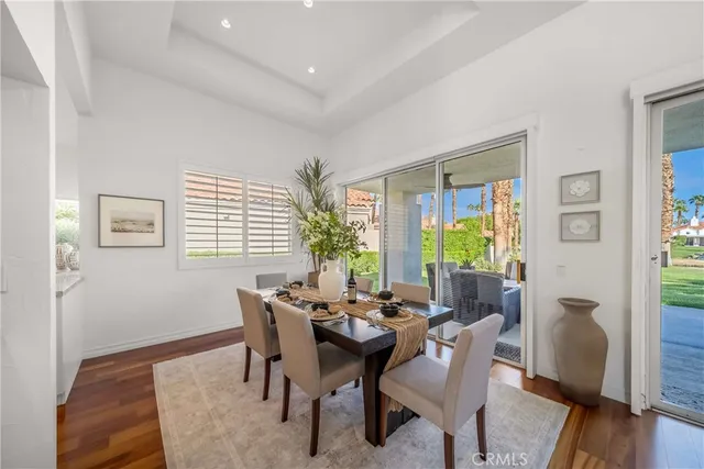 a spacious bathroom with a tub a double vanity sink and a window