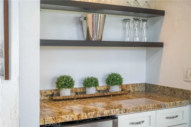 a bedroom with furniture and a flat screen tv