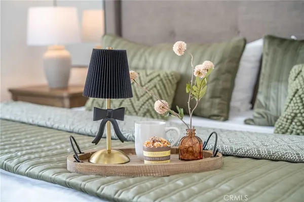 a bedroom with a bed and a night stand