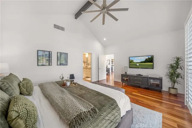 a bedroom with a bed and a couch