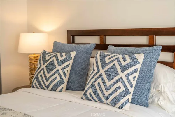 a view of a house with swimming pool and sitting area