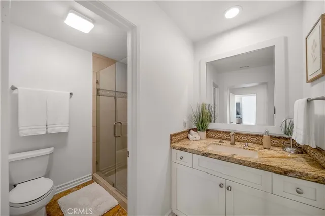 a living room with furniture and a ceiling fan