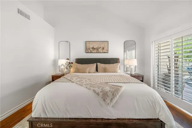 a front view of a house with a garden and patio