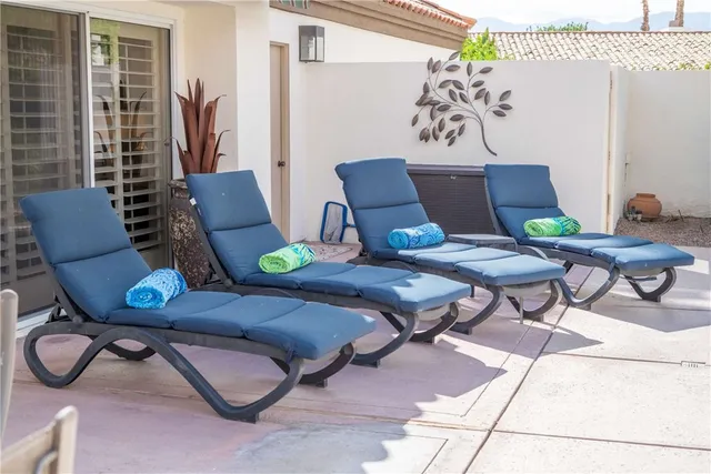 an aerial view of residential building with outdoor space lake view and mountain view in back
