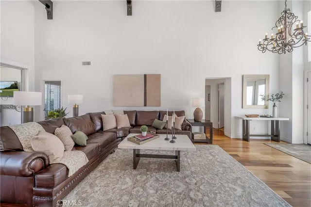a kitchen with a table chairs microwave and cabinets