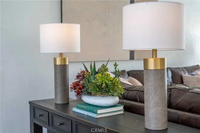 a kitchen with stainless steel appliances granite countertop a stove a sink and a white cabinets