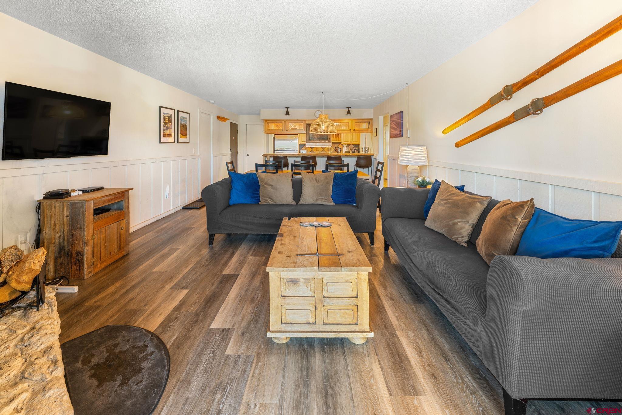 72 Hunter Hill Road, Unit I204 Crested Butte, CO 81225 - Photo 12 of 44 a living room with furniture and a flat screen tv