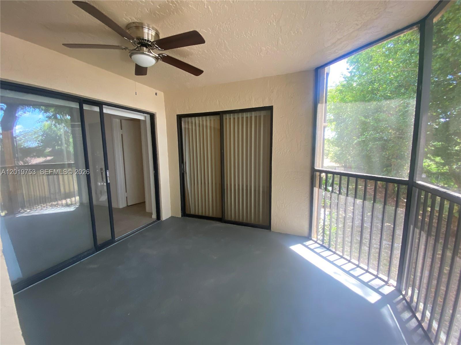 3410 Foxcroft Road, Unit 206 Miramar, FL 33025 - Photo 20 of 23 a view of empty room with wooden floor and fan