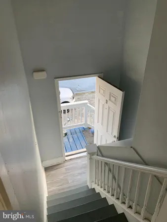 a view of entryway with wooden floor