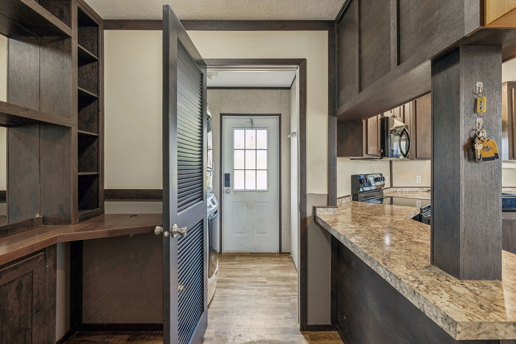3118 McKibbon Road Culleoka, TN 38451 - Photo 11 of 31 a kitchen with kitchen island granite countertop a refrigerator and a sink