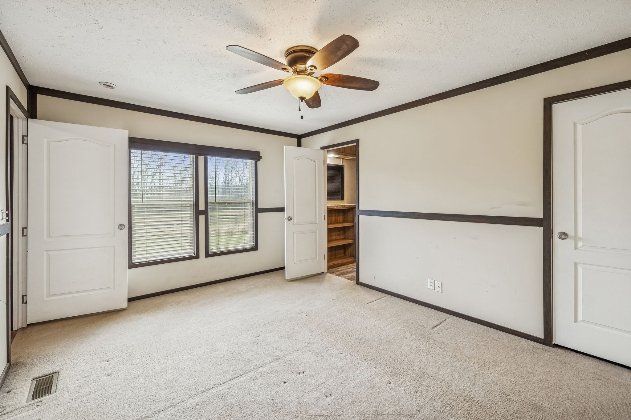 3118 McKibbon Road Culleoka, TN 38451 - Photo 14 of 31 an empty room with closet and ceiling fan