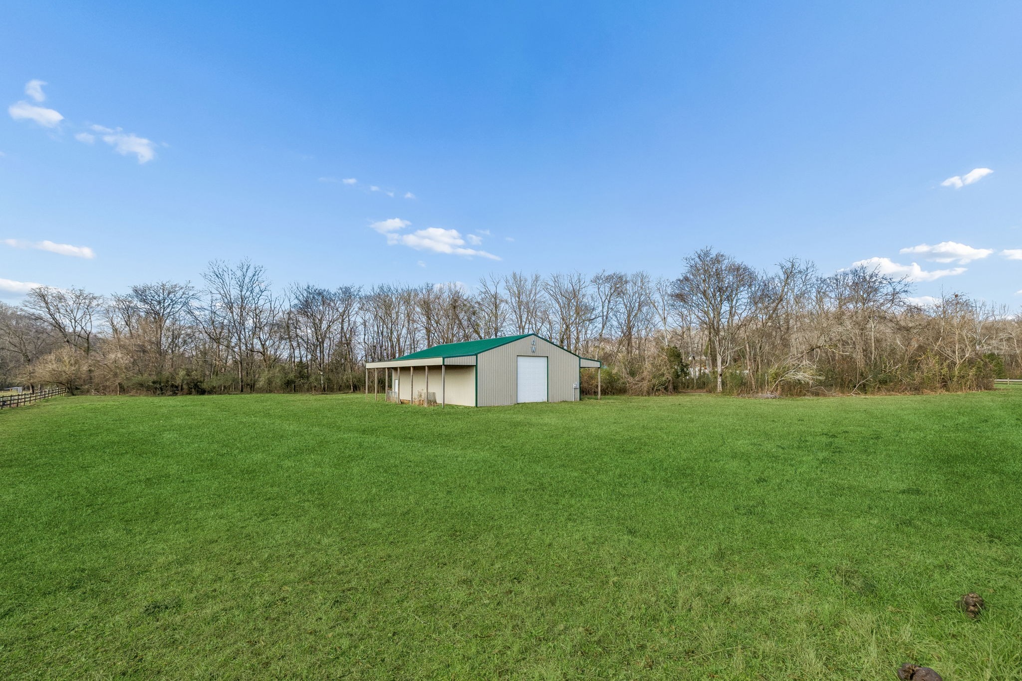 3118 McKibbon Road Culleoka, TN 38451 - Photo 22 of 31 a view of a big yard with large trees