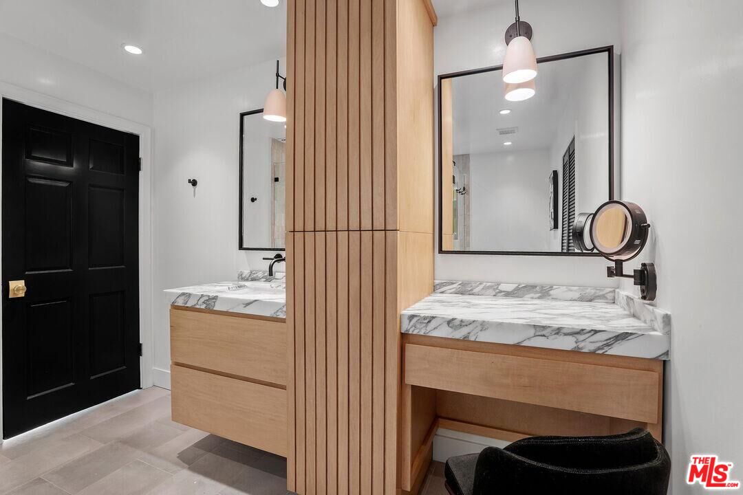 4811 Roma Court Marina del Rey, CA 90292 - Photo 35 of 57 a bathroom with a sink and a mirror