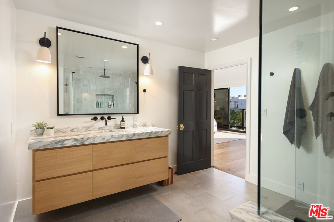 4811 Roma Court Marina del Rey, CA 90292 - Photo 37 of 57 a bathroom with a double vanity sink and mirror