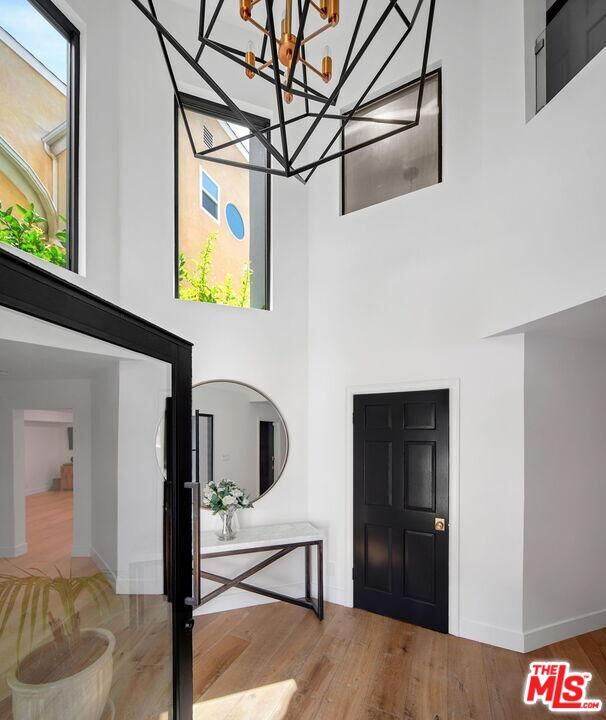 4811 Roma Court Marina del Rey, CA 90292 - Photo 9 of 57 a view of entryway and hall with wooden floor