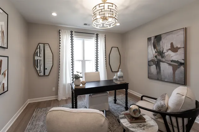 a bedroom with furniture and a window