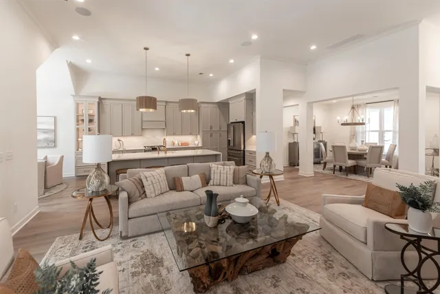 a living room with furniture and a table