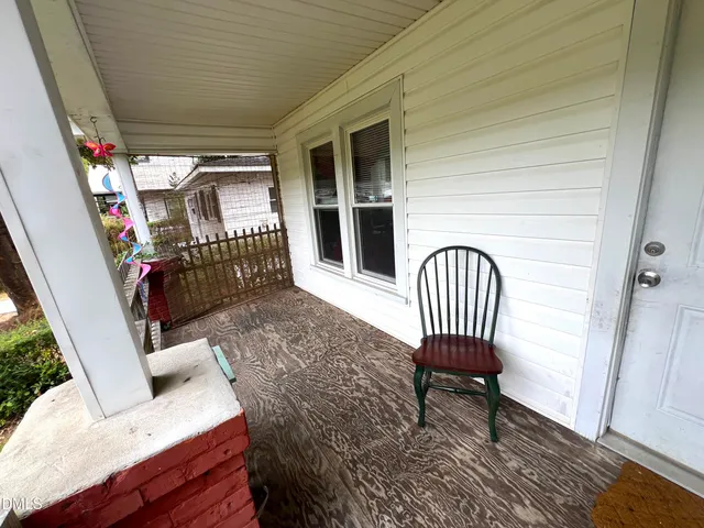 a view of a porch with furniture