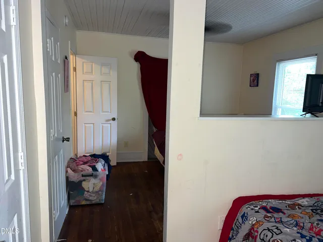 a view of hallway with livingroom and a hallway