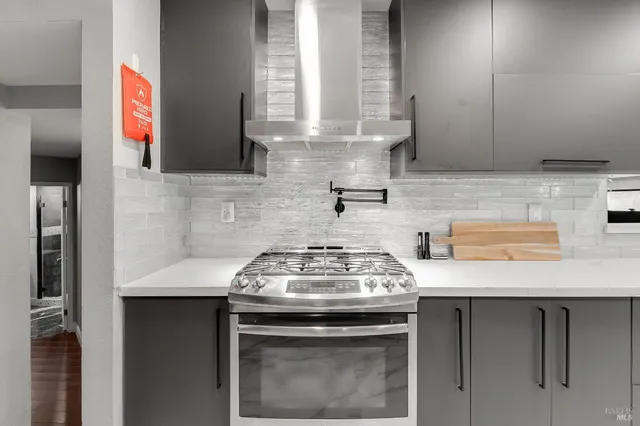 a bathroom with a granite countertop shower a sink and a mirror