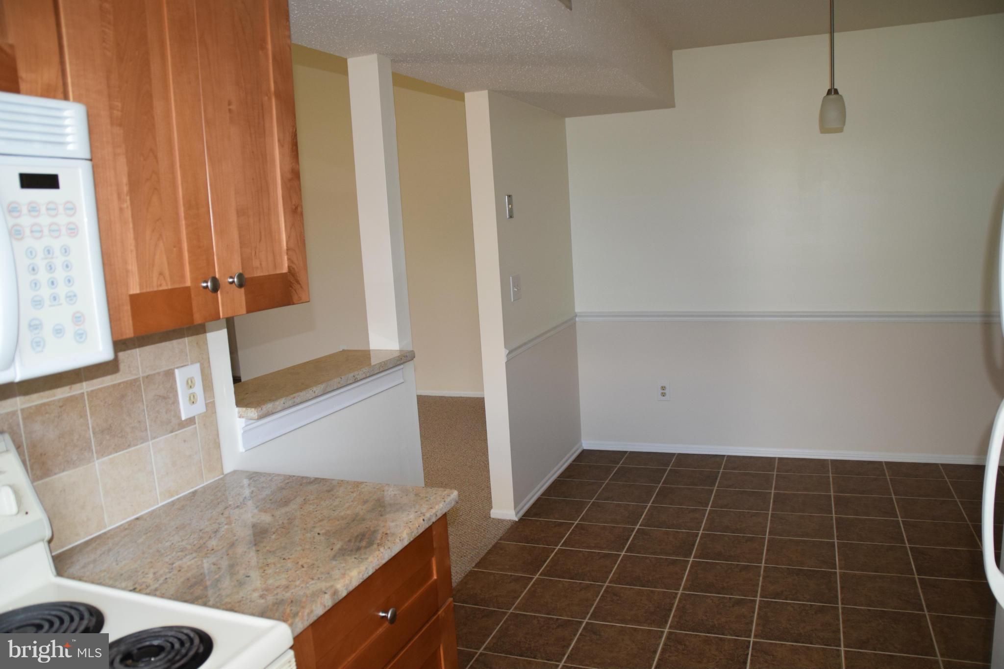 119 Fort Evans Road Southeast, Unit E Leesburg, VA 20175 - Photo 12 of 29 a view of a kitchen cabinets