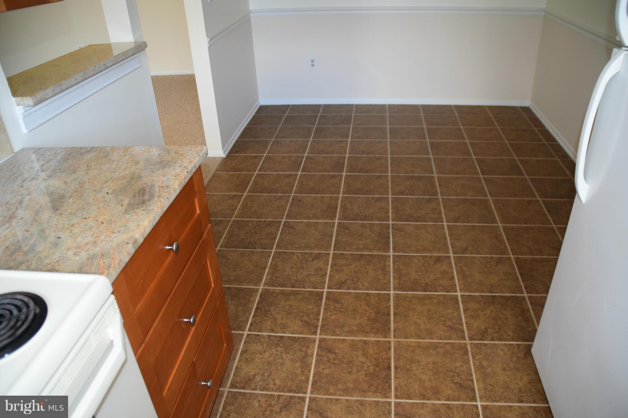 119 Fort Evans Road Southeast, Unit E Leesburg, VA 20175 - Photo 13 of 29 a bathroom with a sink and washing machine