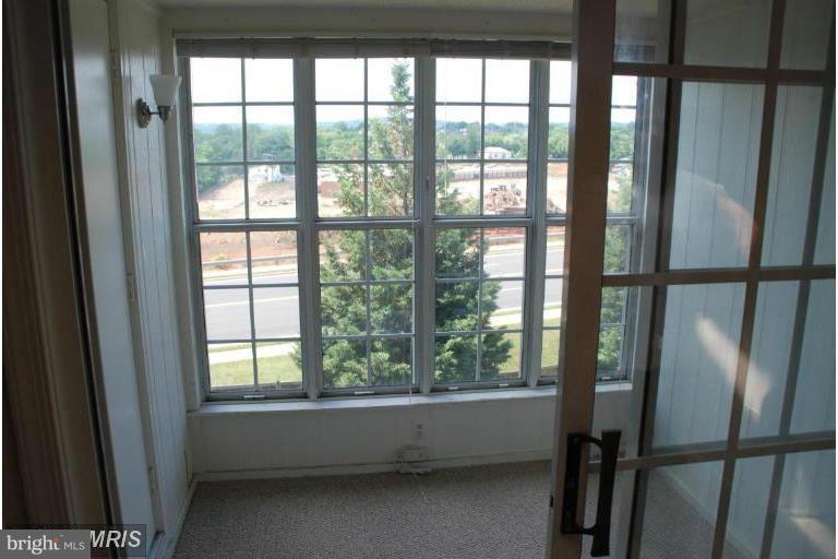 119 Fort Evans Road Southeast, Unit E Leesburg, VA 20175 - Photo 20 of 29 a view of an empty room with a window