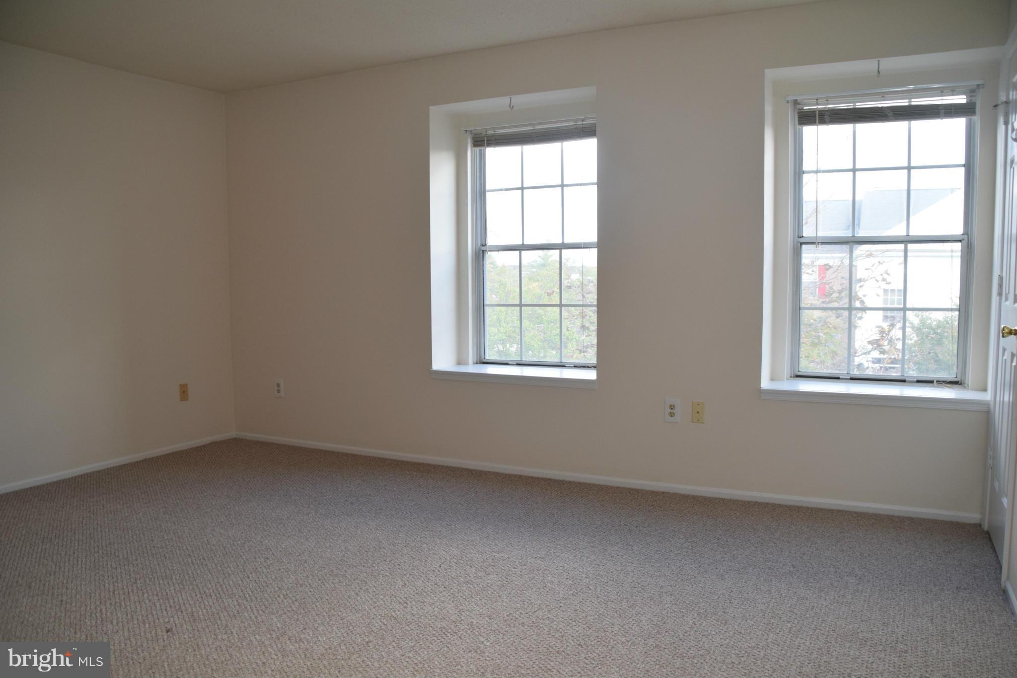119 Fort Evans Road Southeast, Unit E Leesburg, VA 20175 - Photo 22 of 29 an empty room with a window