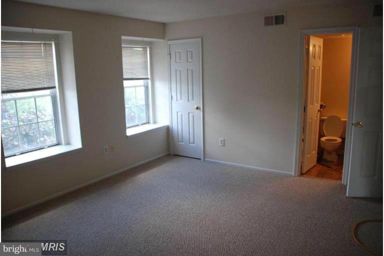 119 Fort Evans Road Southeast, Unit E Leesburg, VA 20175 - Photo 23 of 29 a view of an empty room with a window